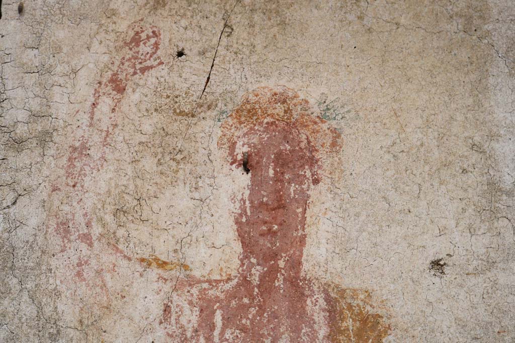 II.9.1 Pompeii. December 2018.
Detail of painting of face of Bacchus on south face of column on the north side of the triclinium.
Photo courtesy of Aude Durand.