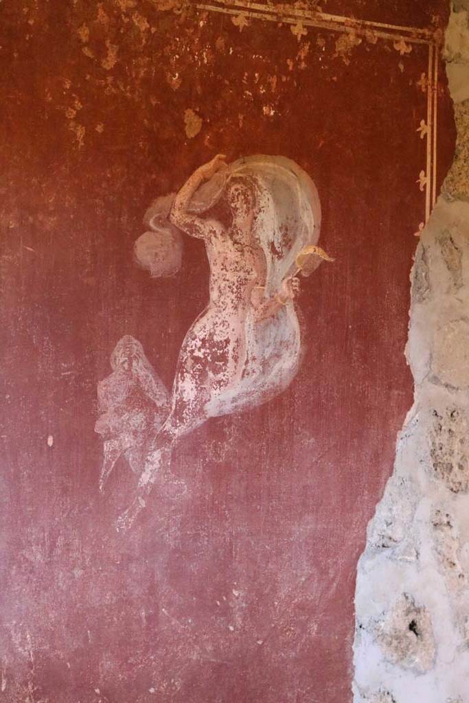 II.9.4 Pompeii. December 2018.
Room 6, painted figure on red panel on west wall. Photo courtesy of Aude Durand.