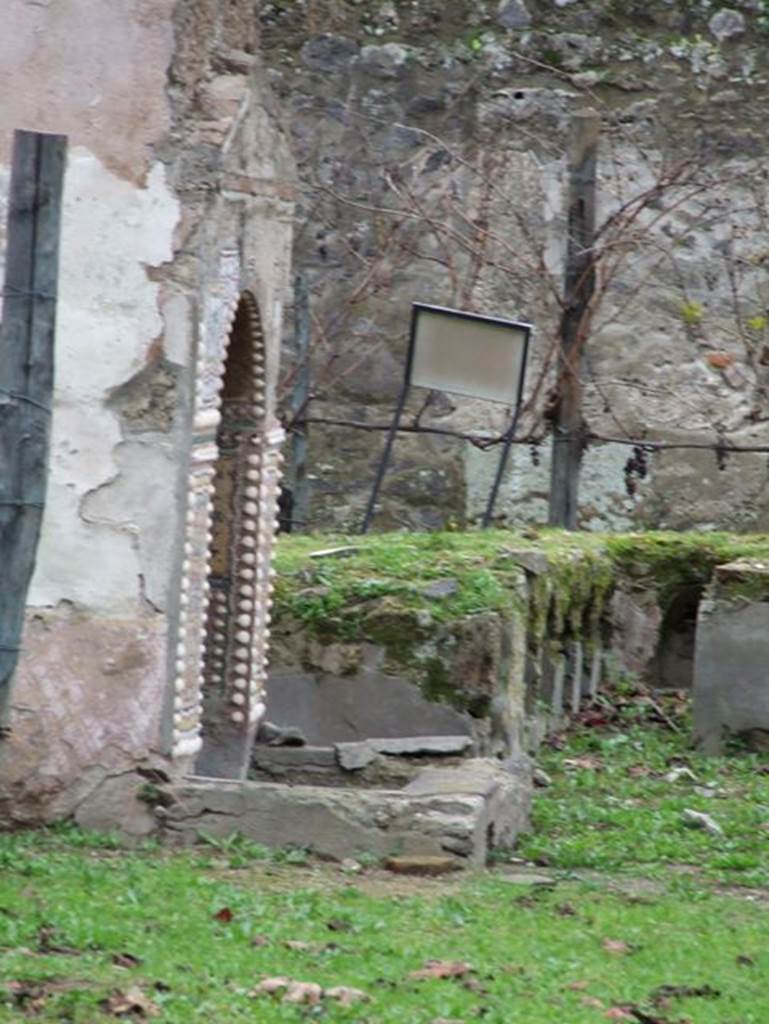 II.9.7 Garden entrance to House of Summer Triclinium. December 2006.
East wall of south mosaic fountain.