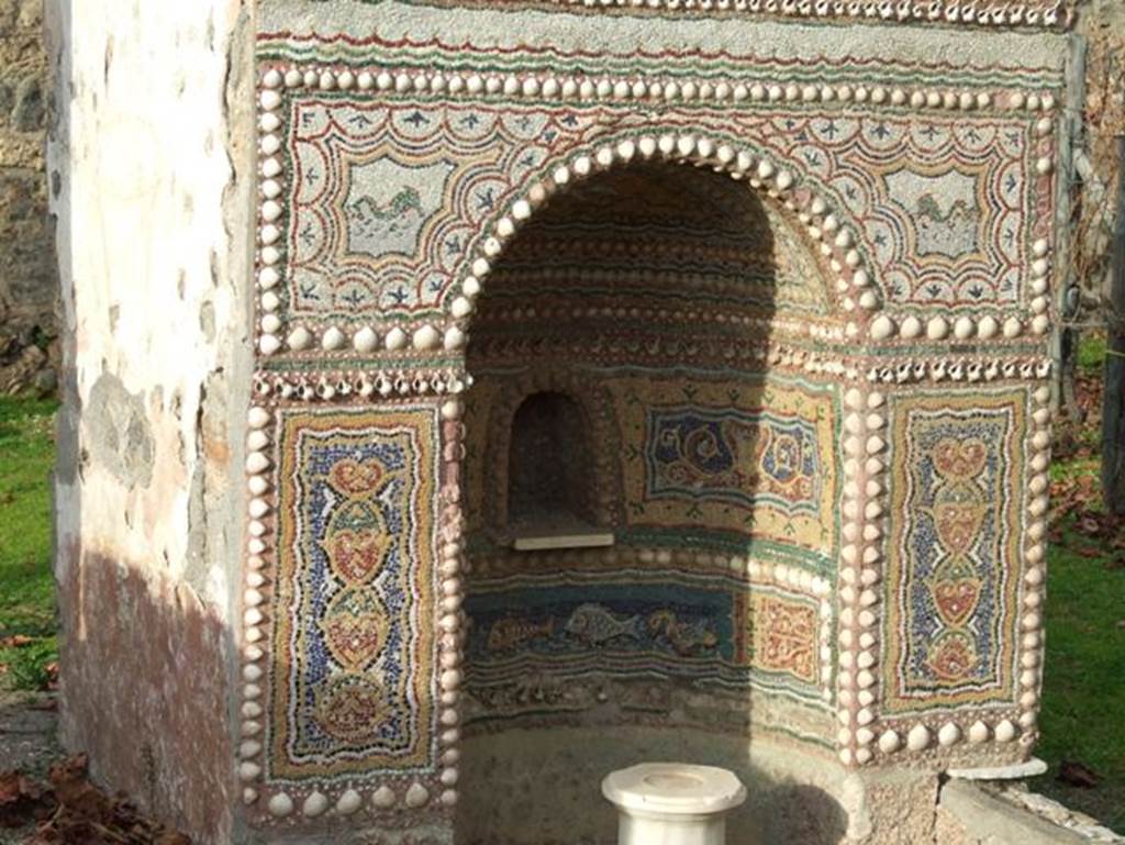 II.9.7. Garden entrance to House of Summer Triclinium. December 2007. Front mosaic face of fountain on north side.