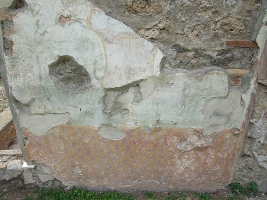 II.9.7. Garden entrance to House of Summer Triclinium. December 2007. East face of north fountain. Painted trellis pattern and urn.