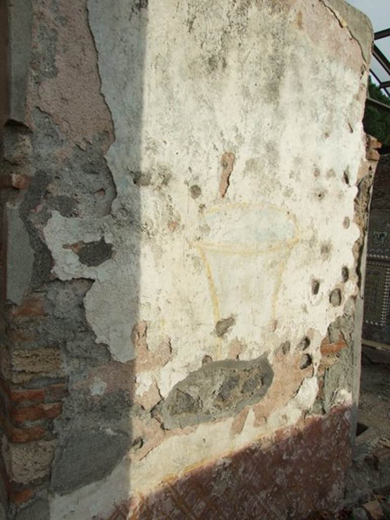 II.9.7. Garden entrance to House of Summer Triclinium. December 2007. West side face of north fountain. Painted urn.