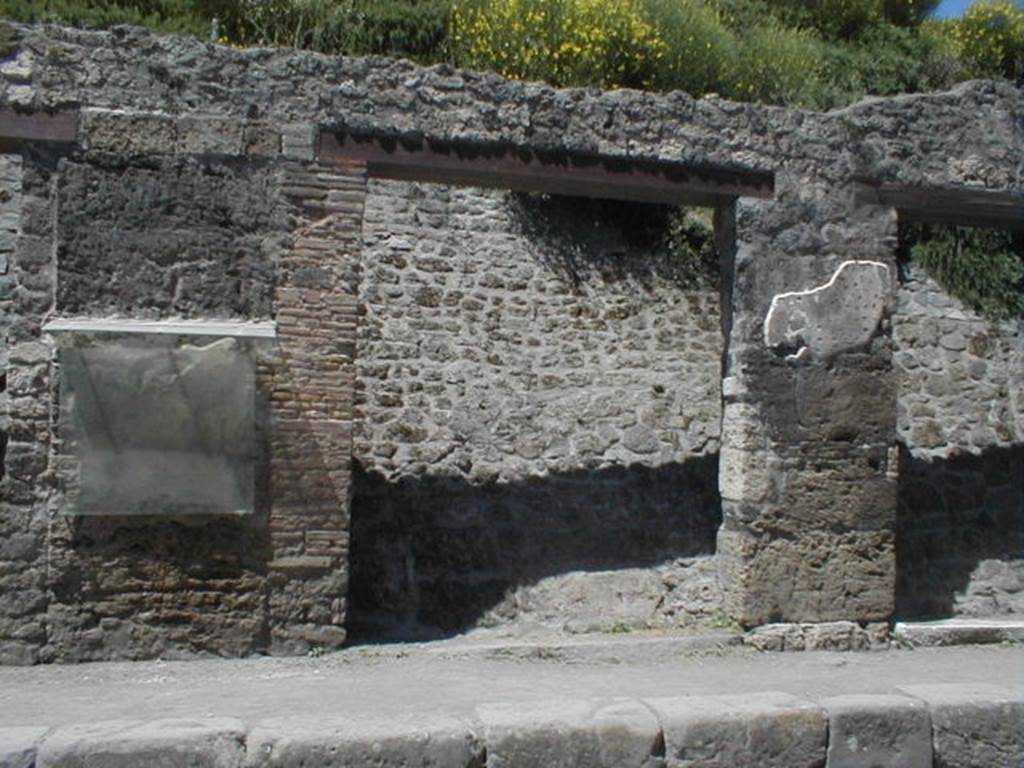 III.1.2 Pompeii. May 2005. Shop entrance, partly excavated. For the graffiti between III.1.1 and 2, on the left, see III.1.1. For the graffiti between III.1.2 and 2, on the right, see III.1.3.