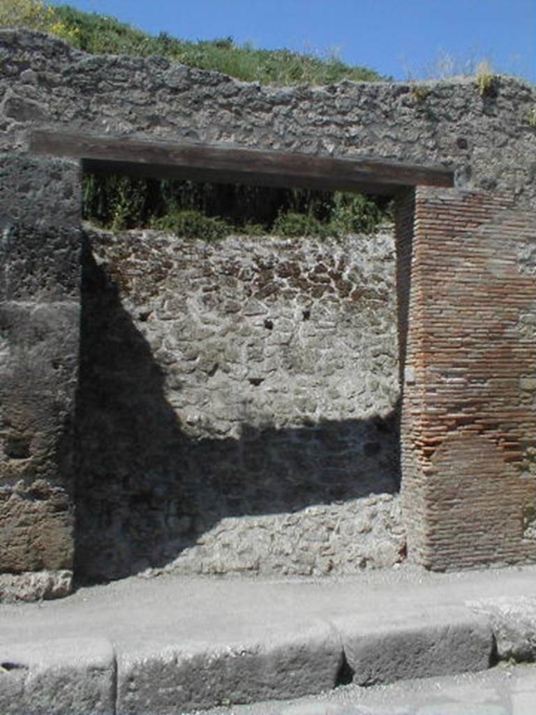 III.1.5 Pompeii. May 2005. Entrance doorway, partly excavated.