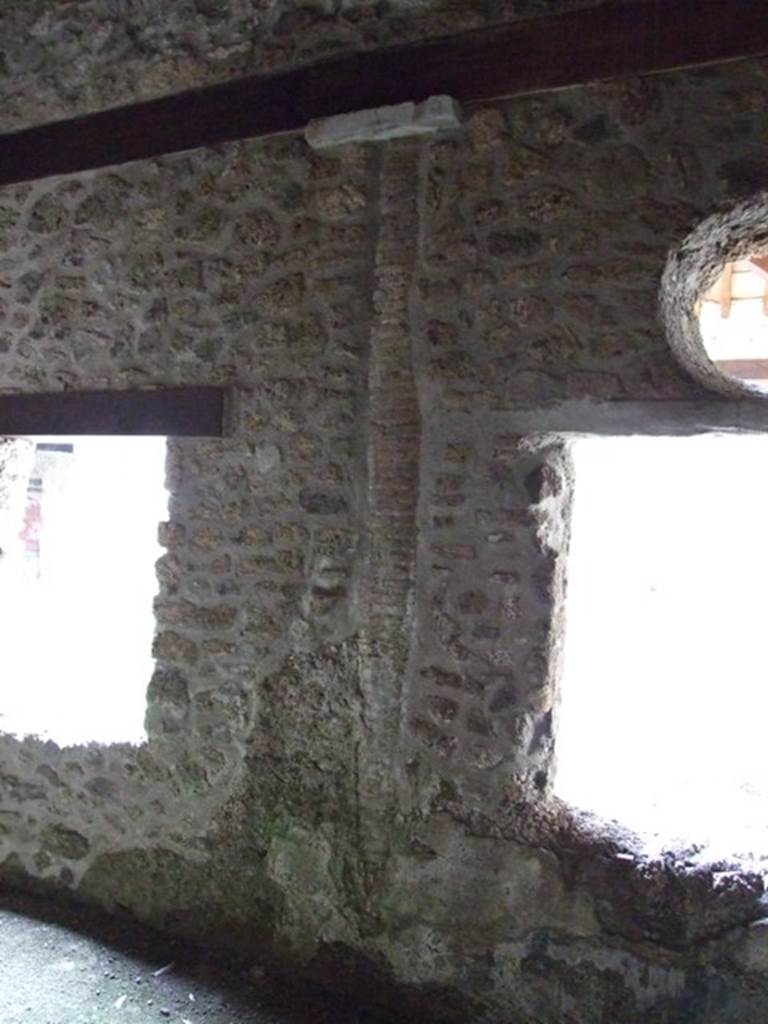 III.2.1 Pompeii.  March 2009.  Room 14. Triclinium?.  West wall between the two windows overlooking the peristyle.