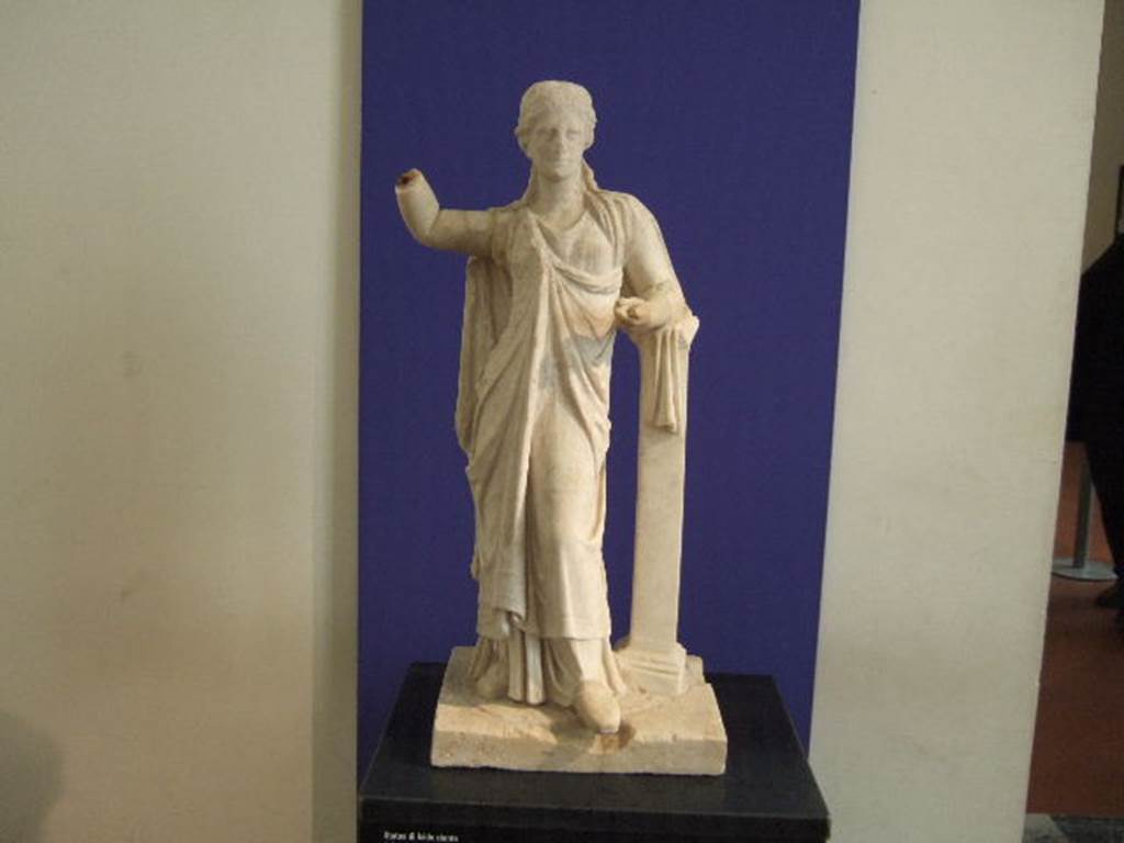 III.4.3 Pompeii. Garden area. Marble statue of standing Isis found on a high pedestal in the middle of the garden.
See Jashemski, W. F., 1993. The Gardens of Pompeii, Volume II: Appendices. New York: Caratzas. (p.102-103)
Now in Naples Archaeological Museum.
According to Della Corte – this white marble statue standing in the centre of the garden was of Diana Parthenos.
See Della Corte, M. Pompeji, the new excavations – houses and inhabitants 1925. (p.60).