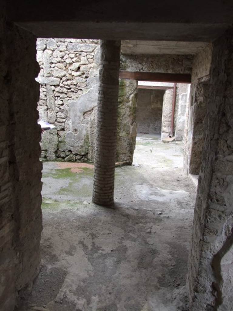 III.4.3 Pompeii. March 2009. Room 12. Looking west, along north portico, also used as a passageway from the atrium of III.4.2 to the service rooms in III.4.3