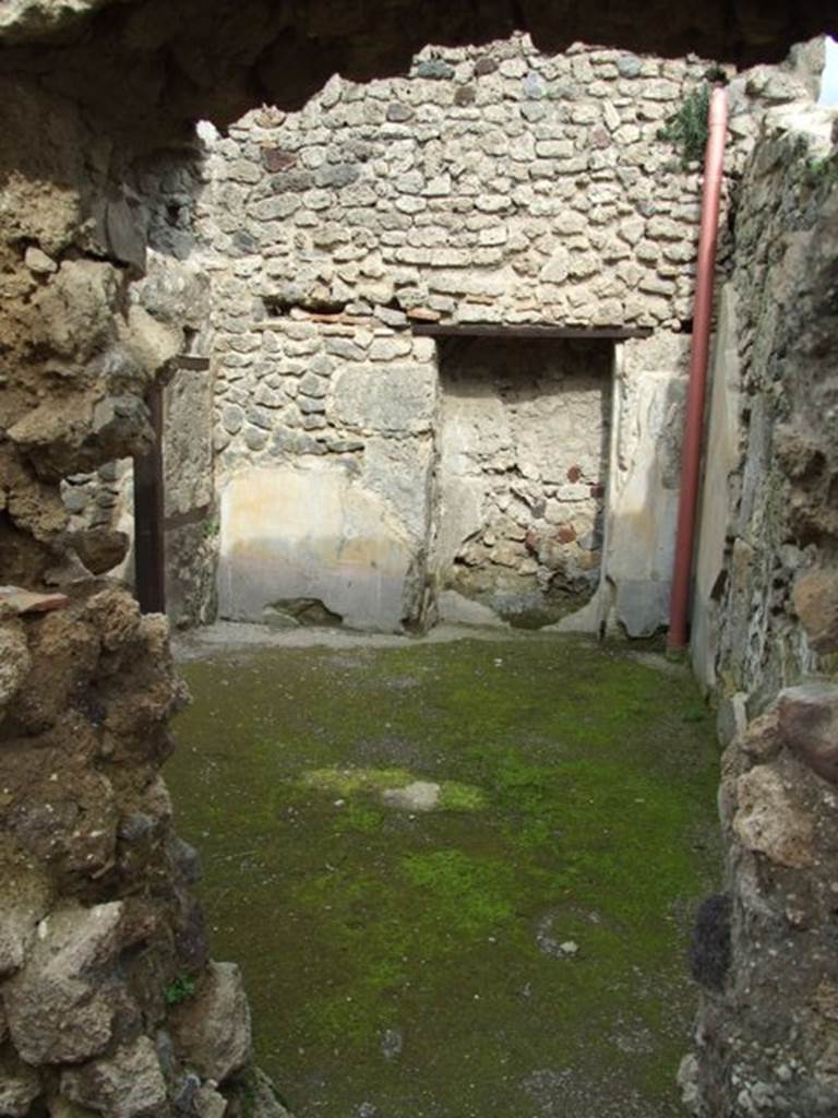 III.4.3 Pompeii. March 2009. Room 23. Looking east through hole in the wall from room 22.