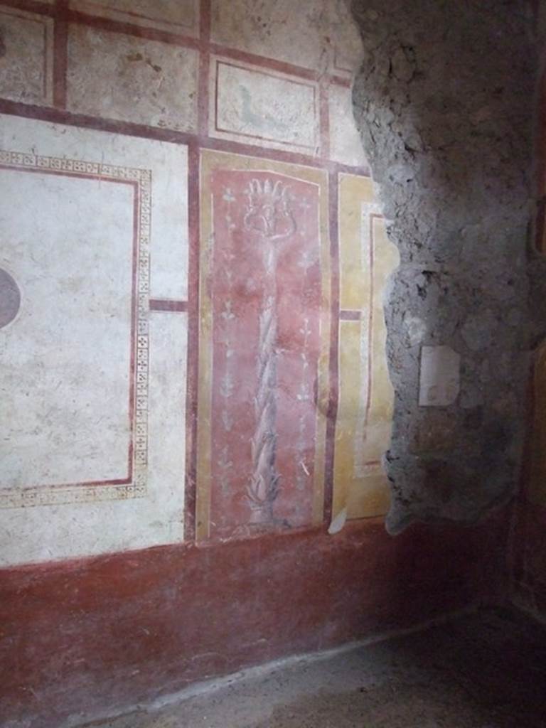 III.4.b Pompeii. March 2009. Room 5, painted candelabra at east end of central panel on north wall of triclinium.