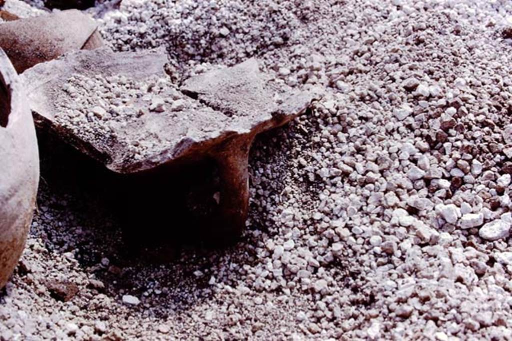III.7 Pompeii. 1976. Top part of large amphora, used as a brazier. Photo by Stanley A. Jashemski.
Source: The Wilhelmina and Stanley A. Jashemski archive in the University of Maryland Library, Special Collections (See collection page) and made available under the Creative Commons Attribution-Non Commercial License v.4. See Licence and use details. J76f0433