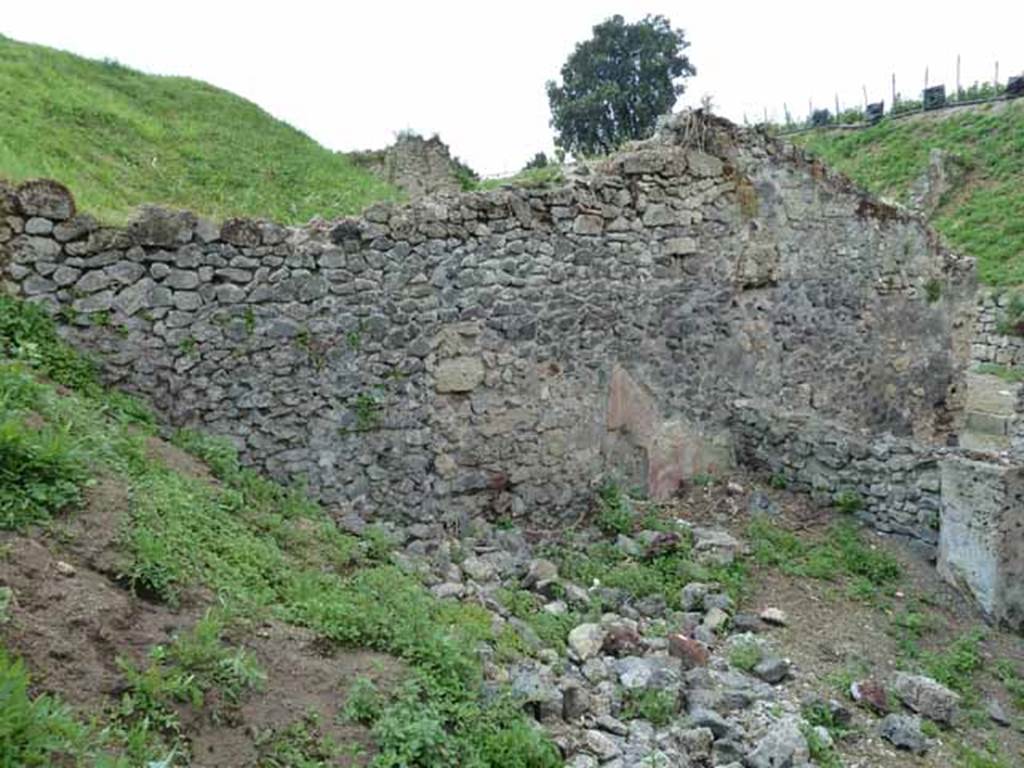 III.8.4 Pompeii. May 2010. West side of atrium, and blocked doorway from III.8.3, on right.