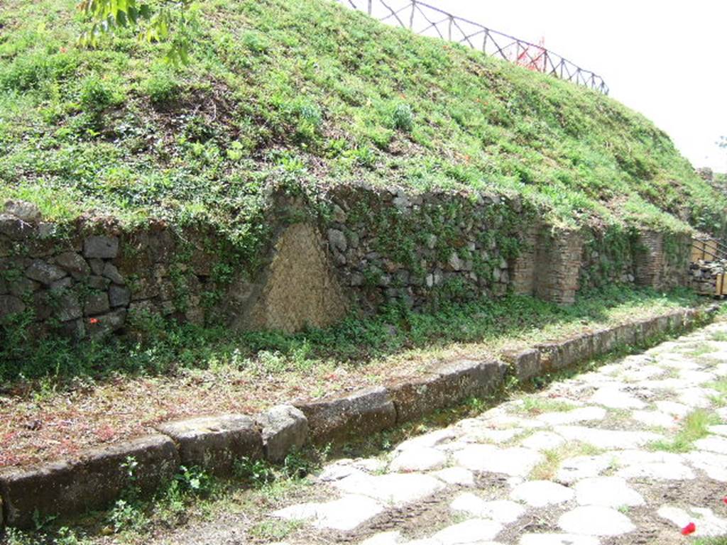 III.9.6, III.9.5, III.9.4 Pompeii. May 2005. Entrances on Via Nola, looking west.