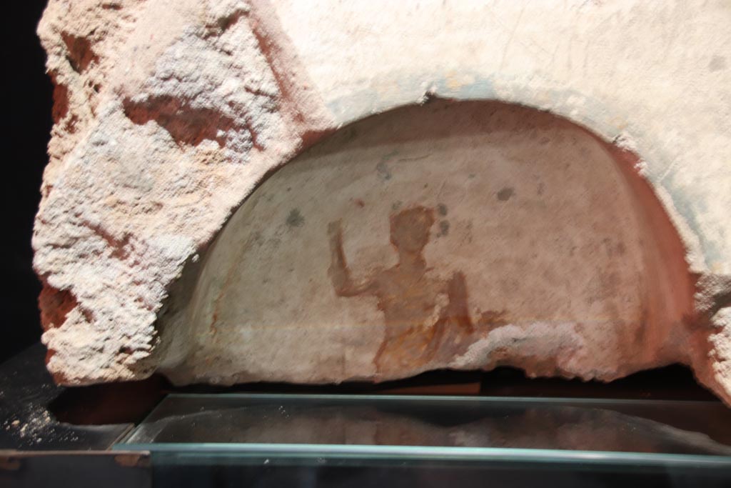 IV.2.e Pompeii? May 2024. Detail of Lararium niche with depiction of Bacchus. Photo courtesy of Klaus Heese.
On display in exhibition entitled – “L’altra Pompei, vite comuni all’ombra del Vesuvio”.