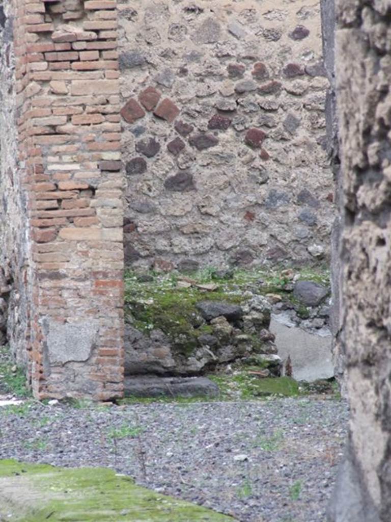 V.1.3 Pompeii. December 2007.
Looking north from the entrance towards room used as a nymphaeum, which had benches on three sides of it and a small pool in the middle.