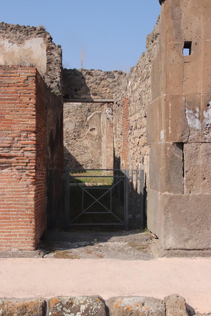 V.1.3 Pompeii. October 2023.
Looking north through entrance doorway. Photo courtesy of Klaus Heese.