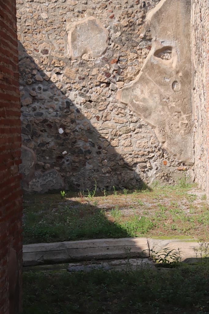 V.1.3 Pompeii. October 2023.
Looking across impluvium in atrium, towards north wall and north-east corner of tablinum.
Photo courtesy of Klaus Heese.