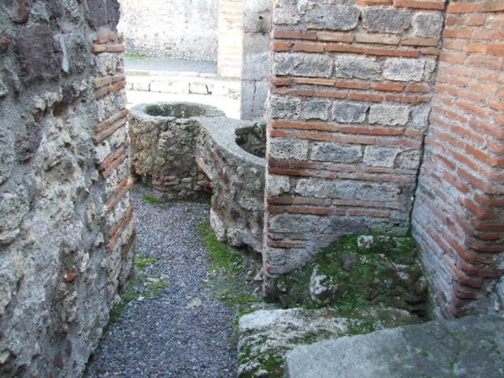 V.1.4 Pompeii. December 2006. South west corner of rear room on west side, with base of stairs to upper floor. Looking south.
