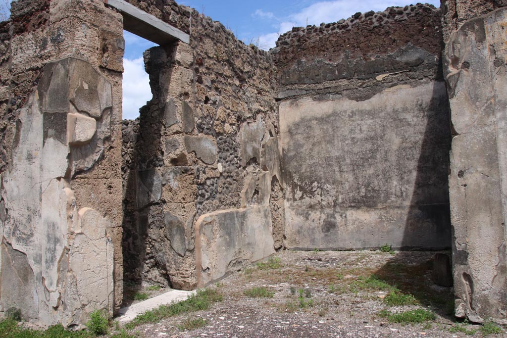 V.1.7 Pompeii. May 2024.
Room 9, east ala, looking towards north-east corner, with doorway to corridor 10, on left. Photo courtesy of Klaus Heese.