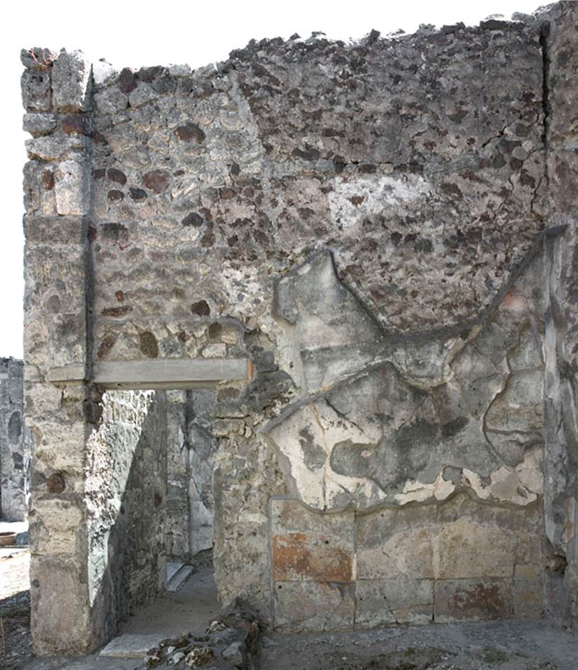 V.1.7 Pompeii. c.2005-7. Room 14, south wall with doorway to room 15. Photo by Hans Thorwid.
Photo courtesy of the Swedish Pompeii Project.