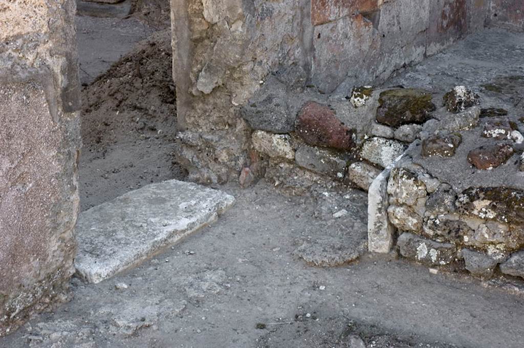 V.1.7 Pompeii. c.2005-7. Room 14, south wall with threshold of doorway to room 15. Photo by Hans Thorwid.
Photo courtesy of the Swedish Pompeii Project.