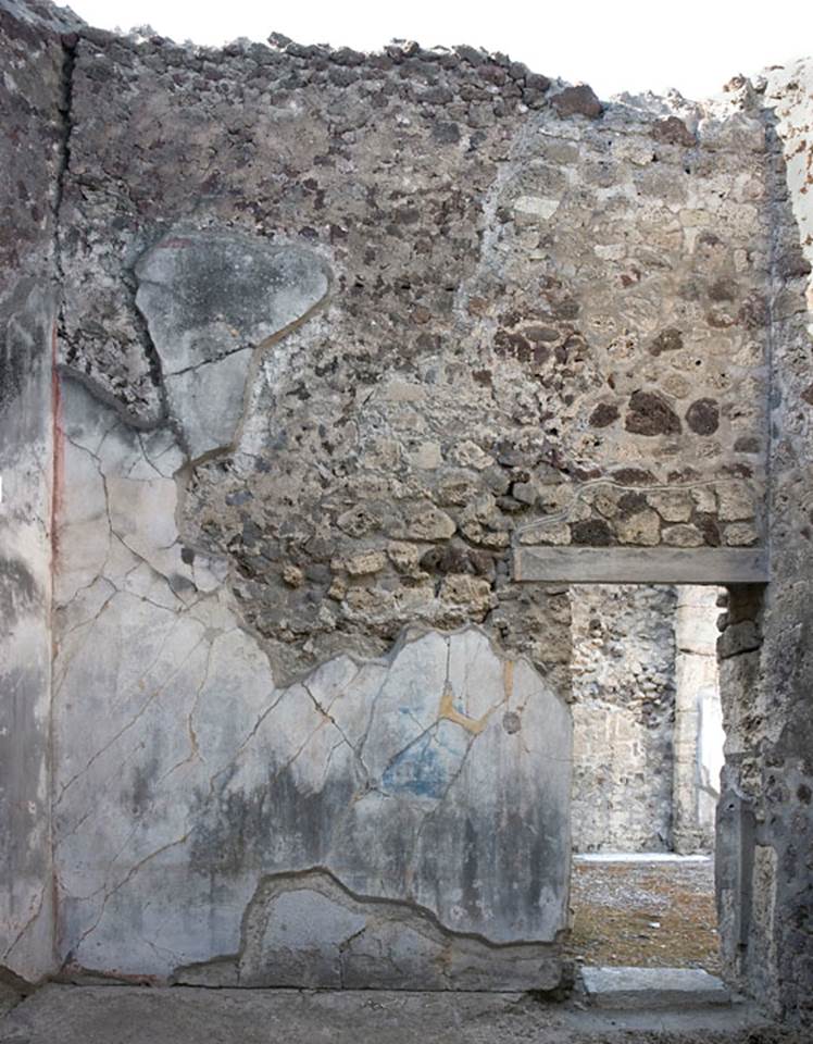 V.1.7 Pompeii. c.2005-7.
Room 15, north wall with doorway into west ala 14/north-west corner of atrium 4. Photo by Hans Thorwid.
Photo courtesy of the Swedish Pompeii Project.