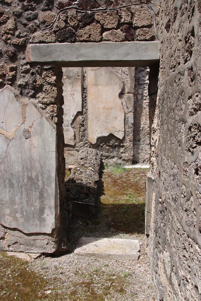 V.1.7 Pompeii. May 2024.
Room 15, doorway into room 14 at east end of north wall. Photo courtesy of Klaus Heese.