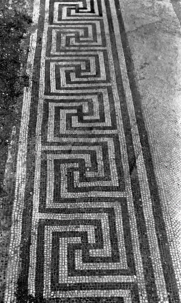 V.1.7 Pompeii. c.1930. Threshold of room 18.
According to Blake, on each end was a mosaic square set into the meander.
See Blake, M., (1930). The pavements of the Roman Buildings of the Republic and Early Empire. Rome, MAAR, 8, (p.84 & Pl. 21, tav.5).