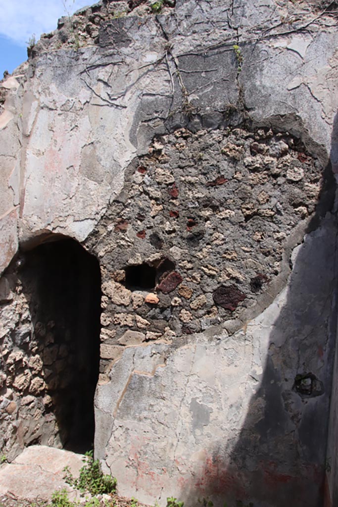 V.1.7 Pompeii. May 2024.
Room 19, east wall with doorway into corridor (h2). Photo courtesy of Klaus Heese.