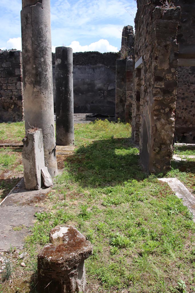 V.1.7 Pompeii. May 2024.
Looking south along west portico with doorway into room “g”, on right. Photo courtesy of Klaus Heese.