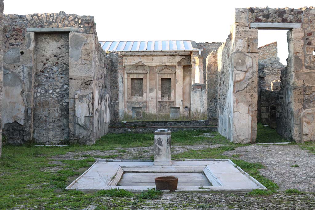 V.1.7, Pompeii. December 2018.
Room 1, looking north across impluvium in atrium, from entrance corridor. Photo courtesy of Aude Durand.