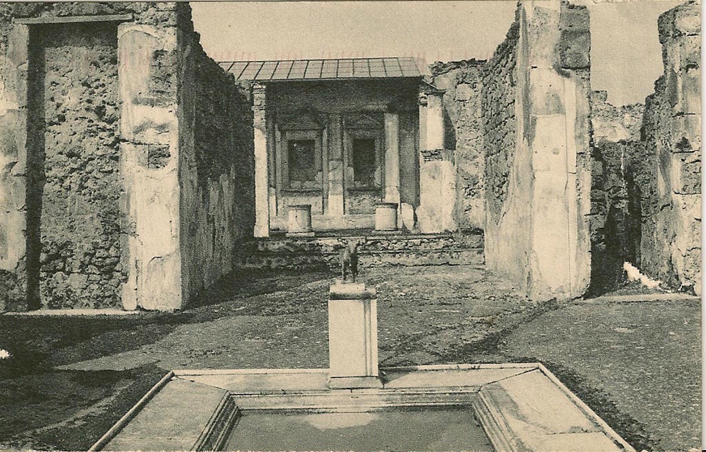V.1.7 Pompeii. 1920s-1930s postcard. Looking north across impluvium in atrium with model of bronze bull, in situ.
Photo courtesy of Rick Bauer.