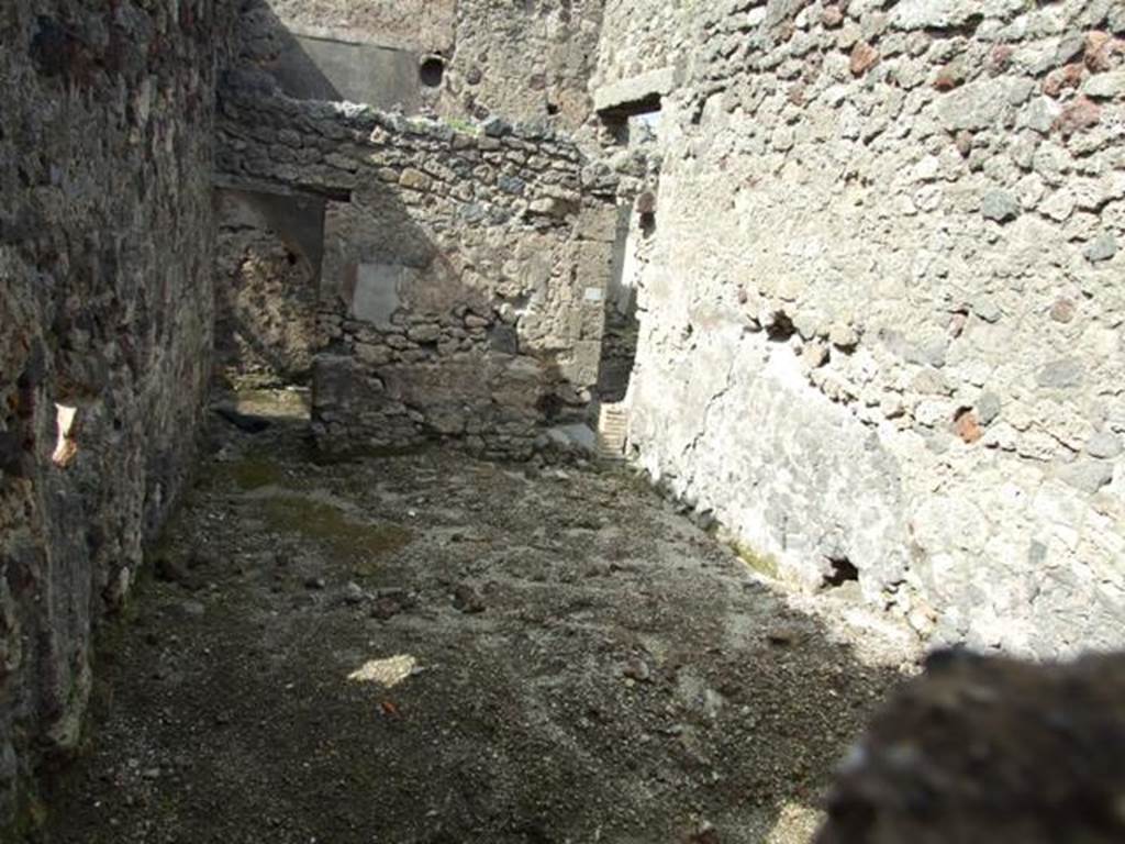 V.1.7 Pompeii. March 2009. Room on south side of Rear entrance fauces, with two doorways. Looking north.