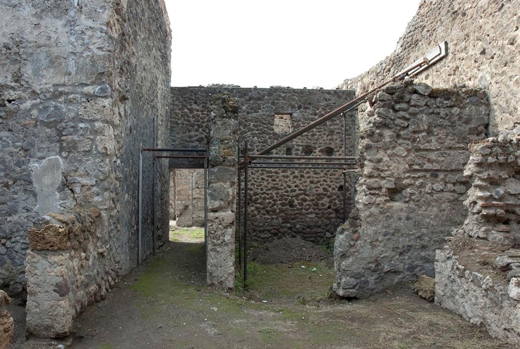 V.1.10/23 Pompeii. c.2005-7.
Room 17, looking west across kitchen area towards corridor to garden area, and stable, on right. Photo by Hans Thorwid.
Photo courtesy of the Swedish Pompeii Project.