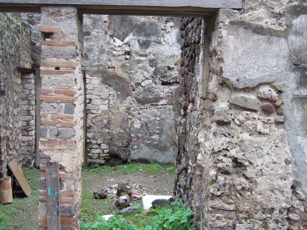 V.1.12 Pompeii. December 2005. Entrance for steps to upper floor above this services’ area.
Also on the upper floor was an another latrine, above the one below in the room next to the kitchen.