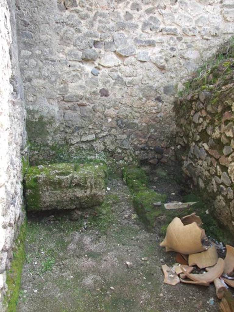 V.1.15 Pompeii. April 2009.
Looking south through doorway into kitchen/latrine in south-east corner of bakery