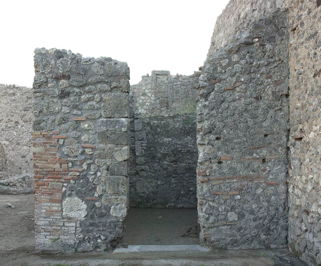 V.1.15 Pompeii. 2012.
East wall of atrium on south side, with doorway into room after restoration in 2008.
Photo by Hans Thorwid.
Photo courtesy of the Swedish Pompeii Project, (see room f)