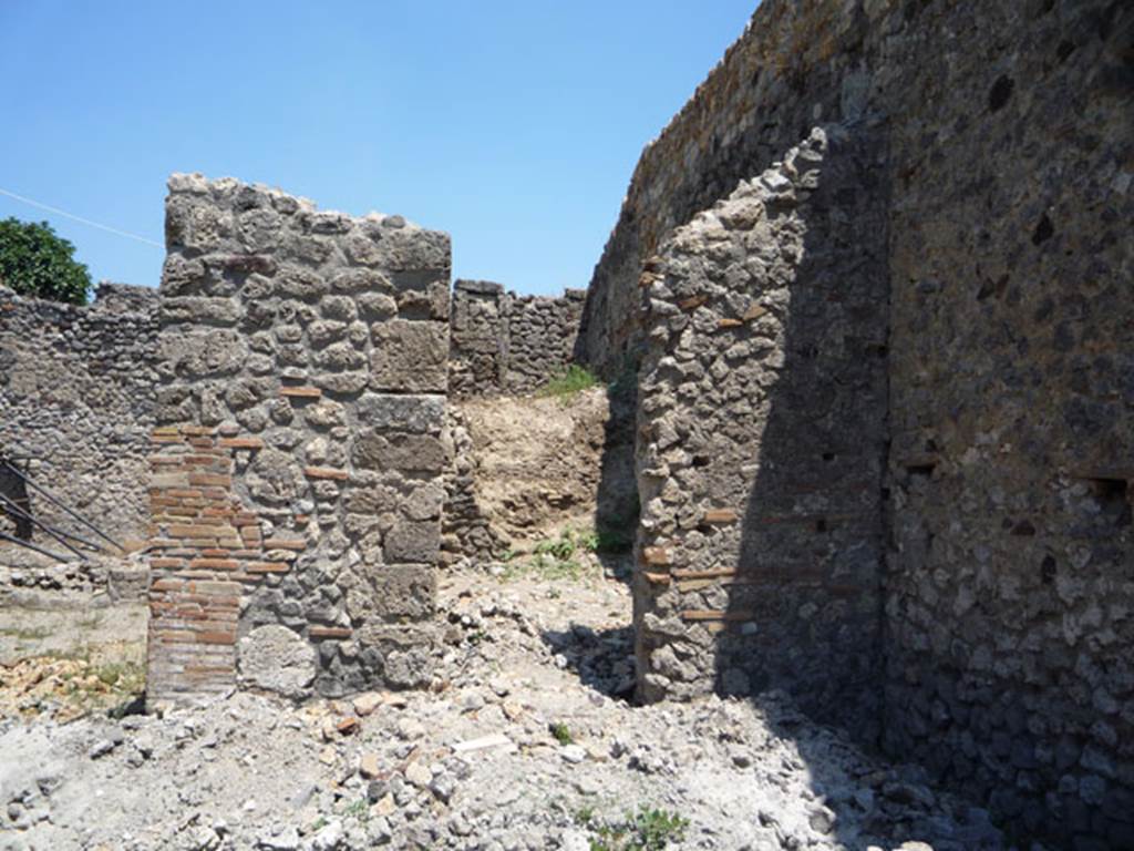 V.1.15 Pompeii. July 2008. East wall of atrium in south-east corner, with doorway to room on west side of oven. Photo courtesy of Jared Benton.
