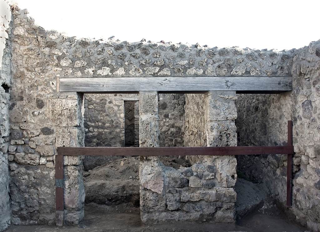 V.1.20 Pompeii. 2001.
East wall of shop-room with doorway to rear room, on left, and to corridor, on right. Photo by Hans Thorwid.
Photo courtesy of The Swedish Pompeii Project.