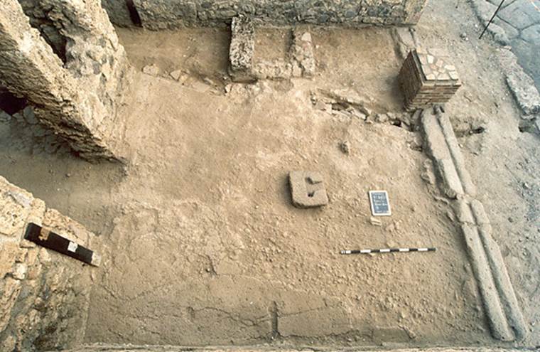 V.1.20 Pompeii. 2001.
Looking down on floor in shop-room, from north side. Photo by Henrik Boman.
Photo courtesy of The Swedish Pompeii Project.