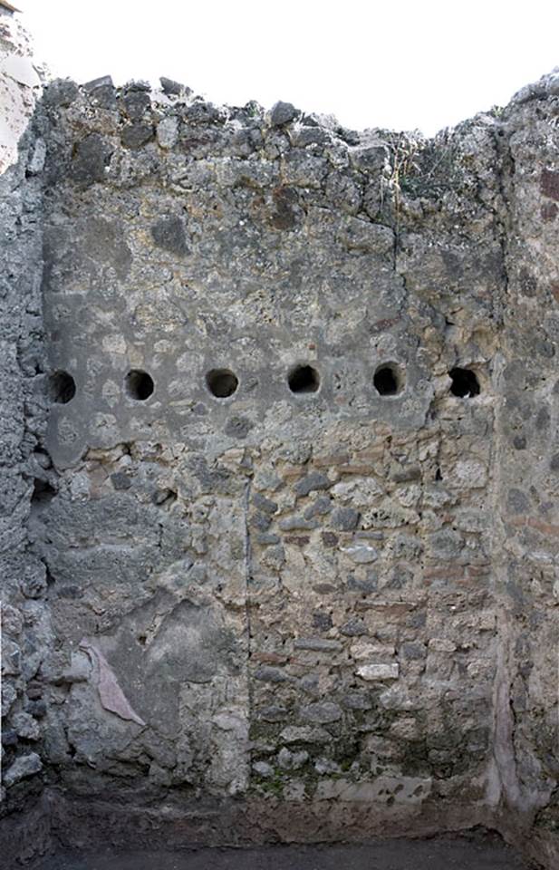 V.1.20 Pompeii. 2005. Room “e”. Photo by Hans Thorwid.
South wall of room in rear south-east corner.
“A walled-up doorway once led into the house at V.1.23.”
Photo and words courtesy of The Swedish Pompeii Project.