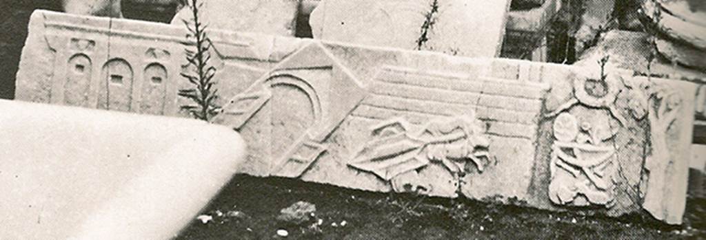 V.1.26 Pompeii. Mid 1880s. Detail from old photograph of items in storage.
Marble slab from above the household altar in atrium.
Scene of the Castellum Acquae and Vesuvian Gate in the earthquake of AD62.