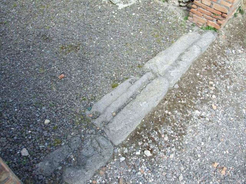 V.2.2 Pompeii. March 2009. Sill or threshold of shop.