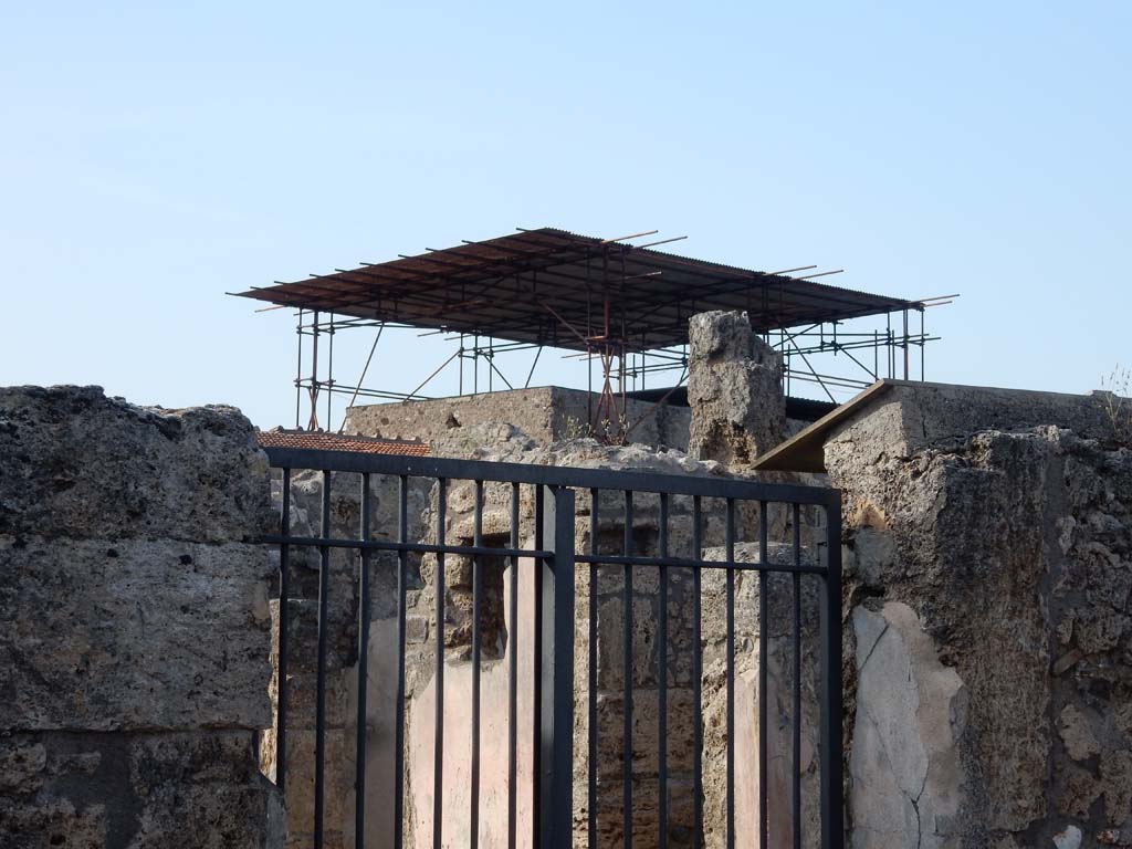 V.2.4 Pompeii. June 2019.
Looking north-east from entrance doorway towards doorway to room 10 with window in room 9, on its left.
Photo courtesy of Buzz Ferebee.
