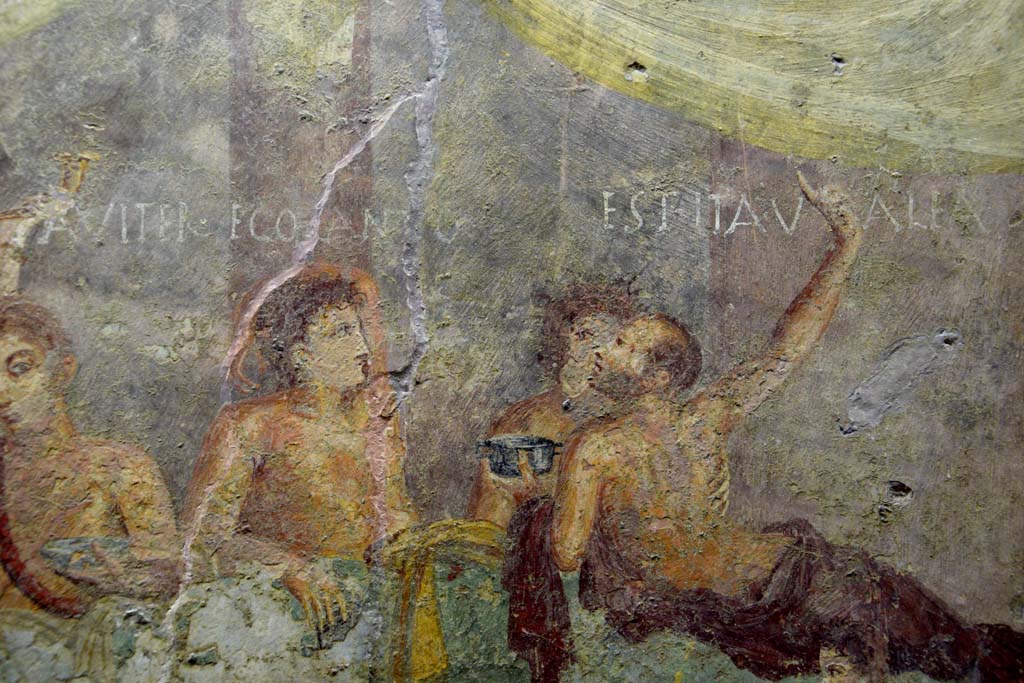 V.2.4 Pompeii. June 2017.
Room 15, detail from east end of the painting of banqueting scene from north wall of triclinium. Photo courtesy of Johannes Eber.