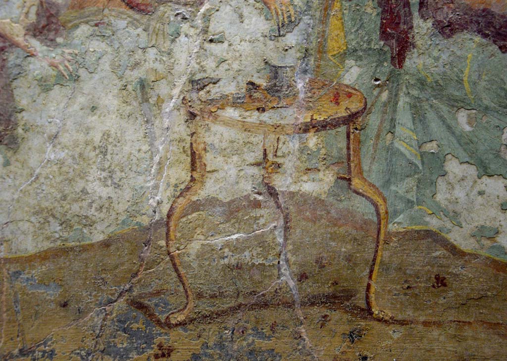 V.2.4 Pompeii. June 2017.
Room 15, detail of a table from the banqueting scene on the north wall of the triclinium. Photo courtesy of Johannes Eber.