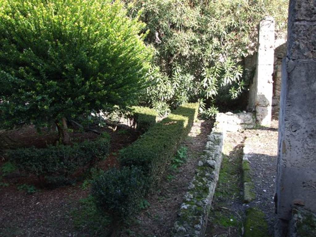 V.2.4 Pompeii. December 2007. Room 13, peristyle drainage channel, looking east towards south-east corner. According to Boyce, in the south-east corner of the garden were painted the two familiar serpents. One on each wall, one on the south and one on the east wall. The altar was painted between them in the corner of the wall. The serpents were brown and yellow on a white ground.
See Boyce G. K., 1937. Corpus of the Lararia of Pompeii. Rome: MAAR 14. (p.34, no.88)