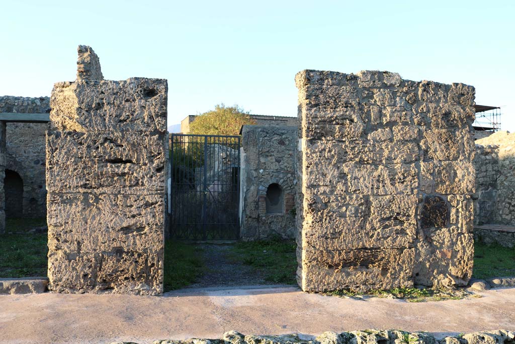 V.2.4, Pompeii. December 2018. Looking north to entrance doorway on Via di Nola. Photo courtesy of Aude Durand.