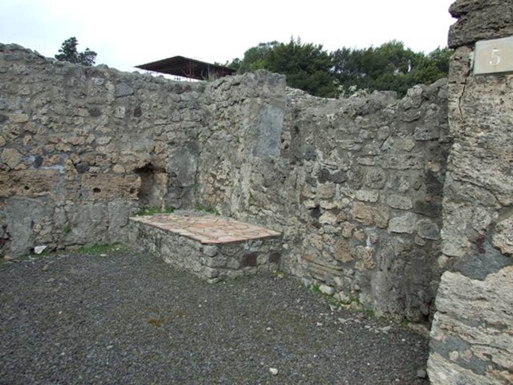 V.2.5 Pompeii. March 2009. East side of shop, with podium or hearth and window to V.2.6.
