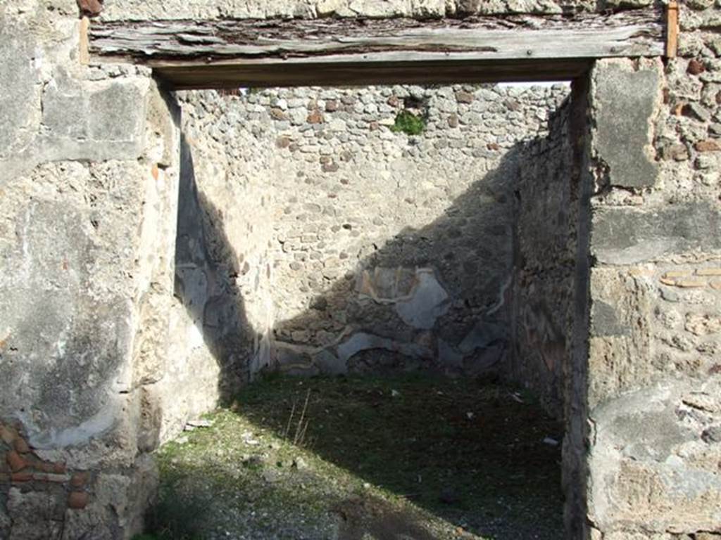 V.2.7 Pompeii. December 2007.
Doorway to room 14, looking east. In the north-west corner of this room a pile of lime was discovered.