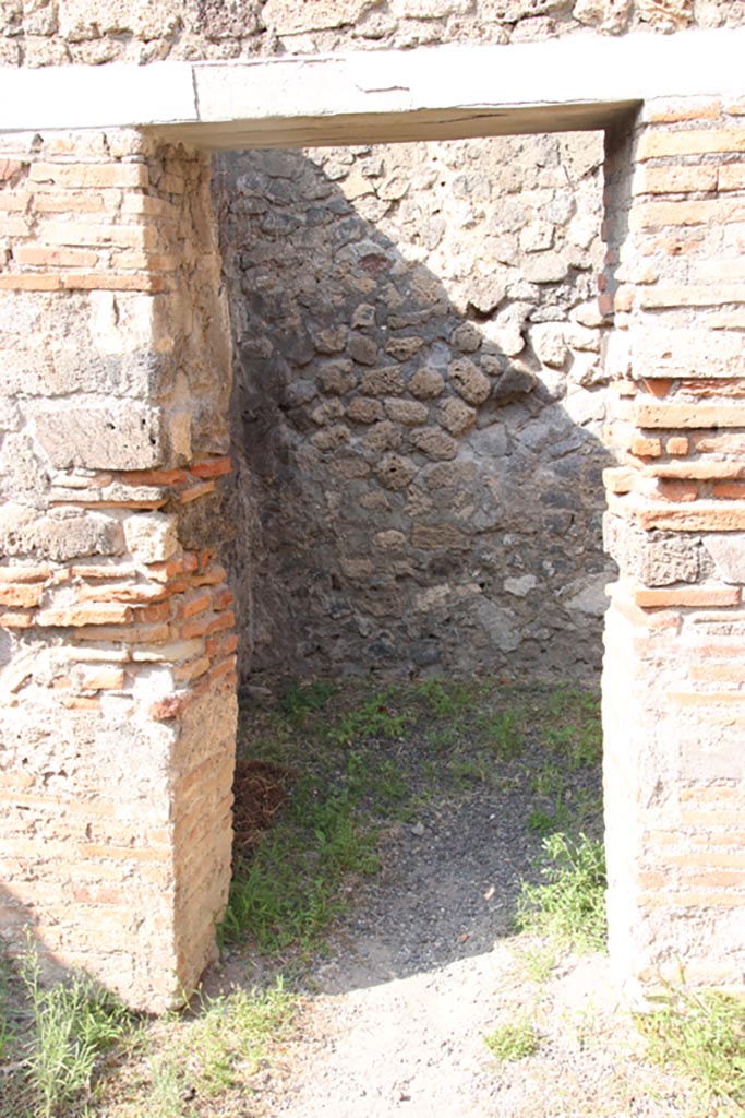 V.2.8 Pompeii. October 2023.
Looking north through doorway into rear room. Photo courtesy of Klaus Heese.